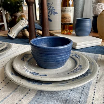 Hand thrown Farmhouse ridges denim dessert bowl stacked on top of a salad then dinner plate