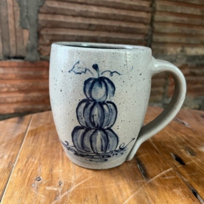                          wheel thrown cafe mug with spring wildflower pattern on a shiplap background